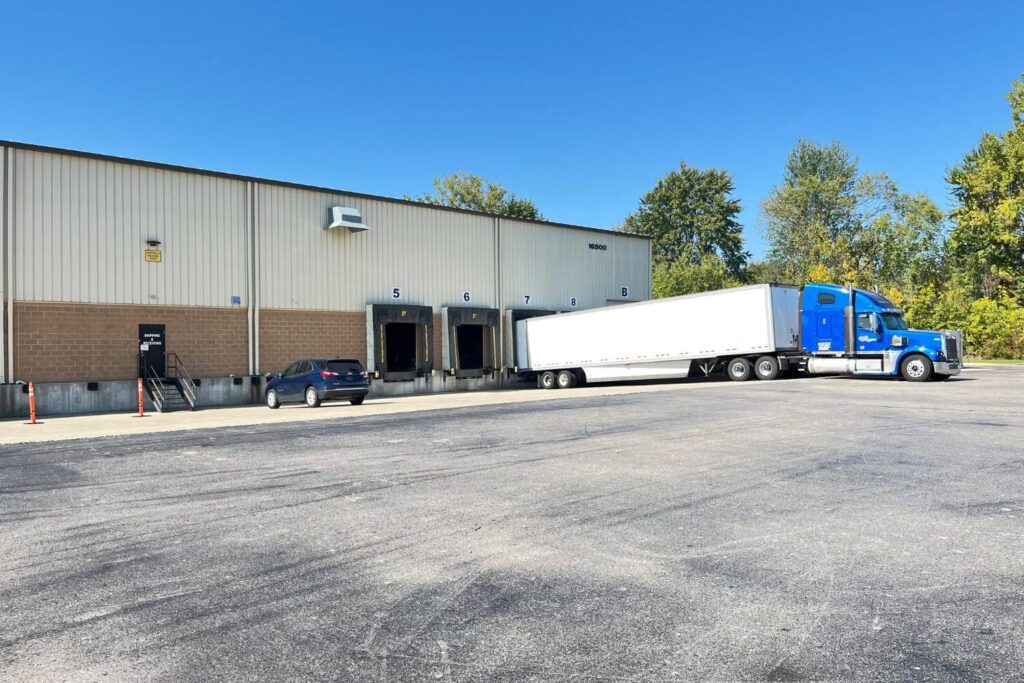 romulus detroit michigan warehouse cross drocking and trucks logos logistics